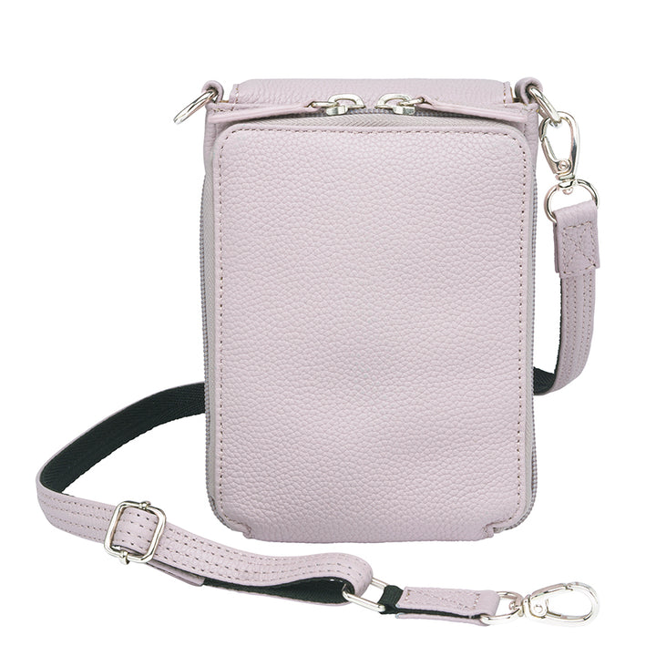 Lavender concealed carry crossbody phone pouch made from pebble grain American cowhide, designed for compact firearm storage with a slim, stylish profile.