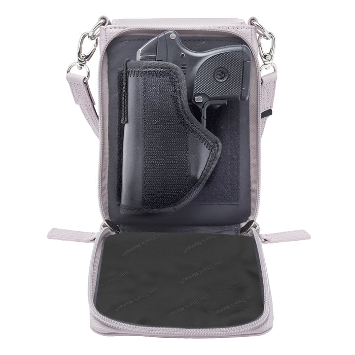 Lavender concealed carry crossbody phone pouch made from pebble grain American cowhide, designed for compact firearm storage with a slim, stylish profile.