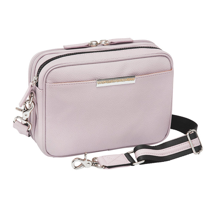 Stylish lavender Slim Clutch crossbody concealed carry bag with slim profile, designed for discreet firearm storage and easy access. Perfect for essentials and compact firearms, offering both elegance and security