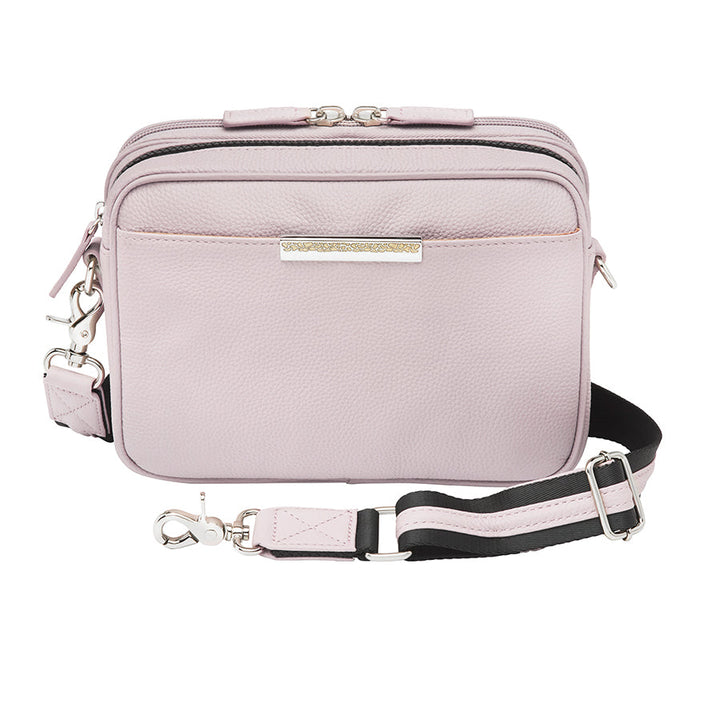 Stylish lavender Slim Clutch crossbody concealed carry bag with slim profile, designed for discreet firearm storage and easy access. Perfect for essentials and compact firearms, offering both elegance and security
