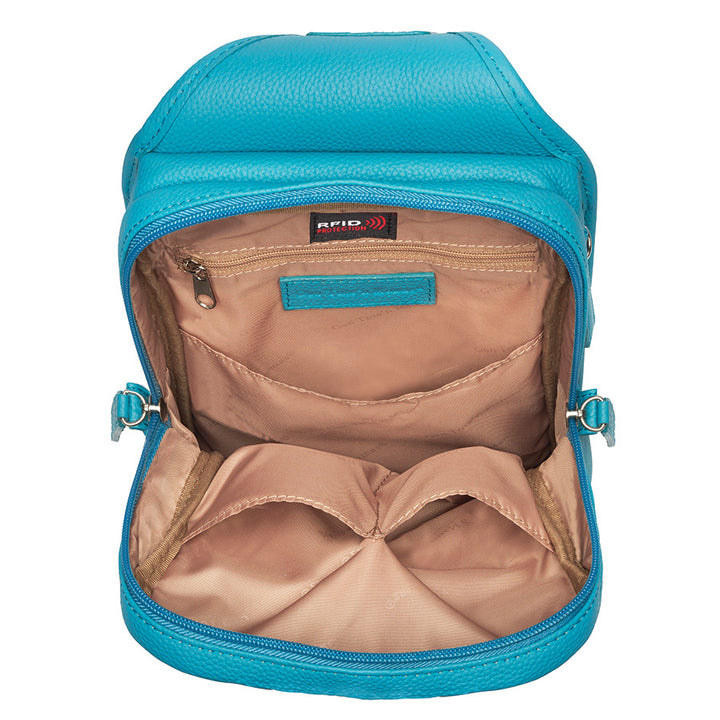Mini Sling concealed carry backpack in turquoise, made from tooled pebble grain American cowhide. Features adjustable strap, secure gun compartment, and compact design for easy carry of essentials, ideal for compact firearms like Kahr 380 and Ruger LCP