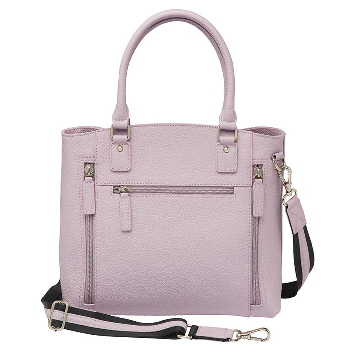 Elegant lavender Town Tote concealed carry purse made from top grain cowhide with pebble texture. Features spacious interior, RFID-blocking pocket, and hidden firearm compartment with dual zip access. Includes slash-resistant strap, chrome hardware, and room for tablets, water bottles, and everyday essentials