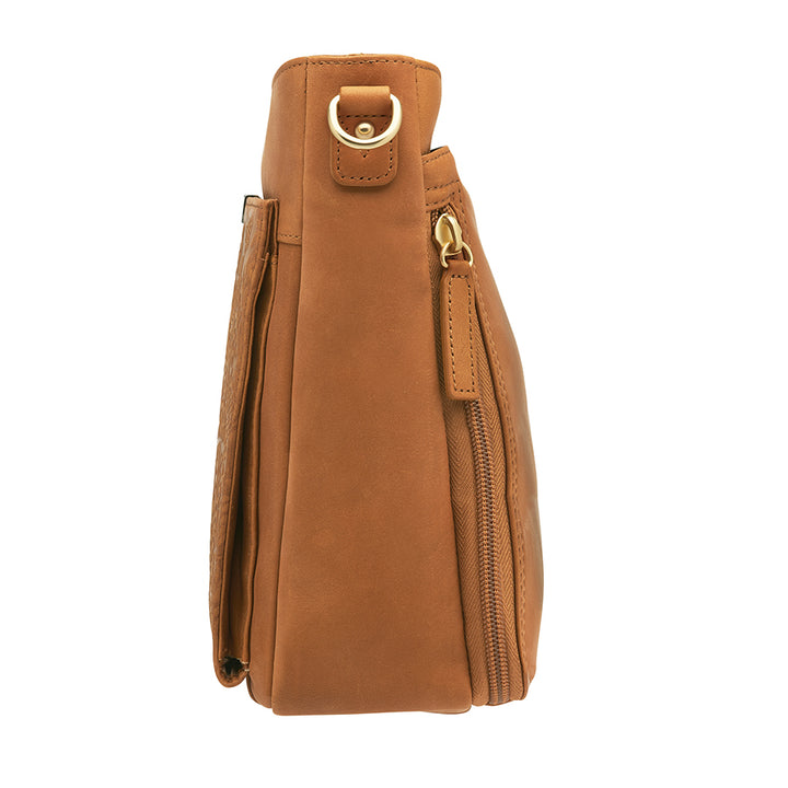 Slim tan concealed carry crossbody bag made from brushed USA cowhide, featuring RFID-blocking front organizer, slash-resistant adjustable strap, and fast-access top-draw gun compartment for left or right-hand draw.