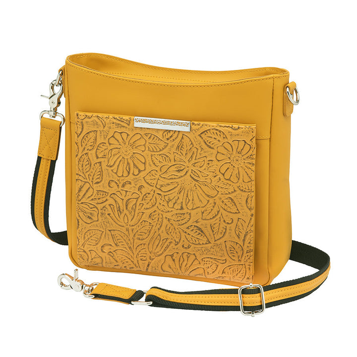 Mustard yellow slim crossbody concealed carry purse crafted from durable American cowhide, featuring compact design and discreet firearm compartment for everyday carry