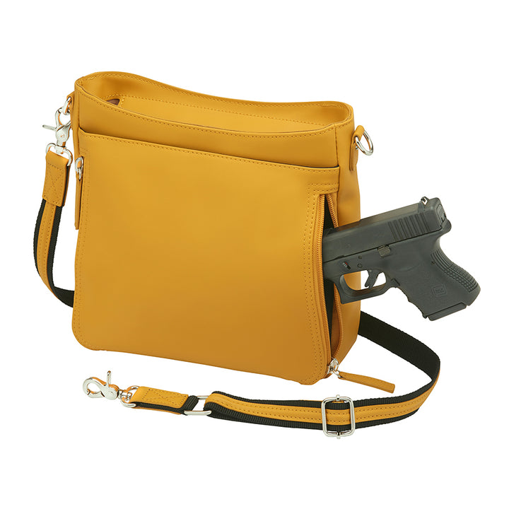 Mustard yellow slim crossbody concealed carry purse crafted from durable American cowhide, featuring compact design and discreet firearm compartment for everyday carry