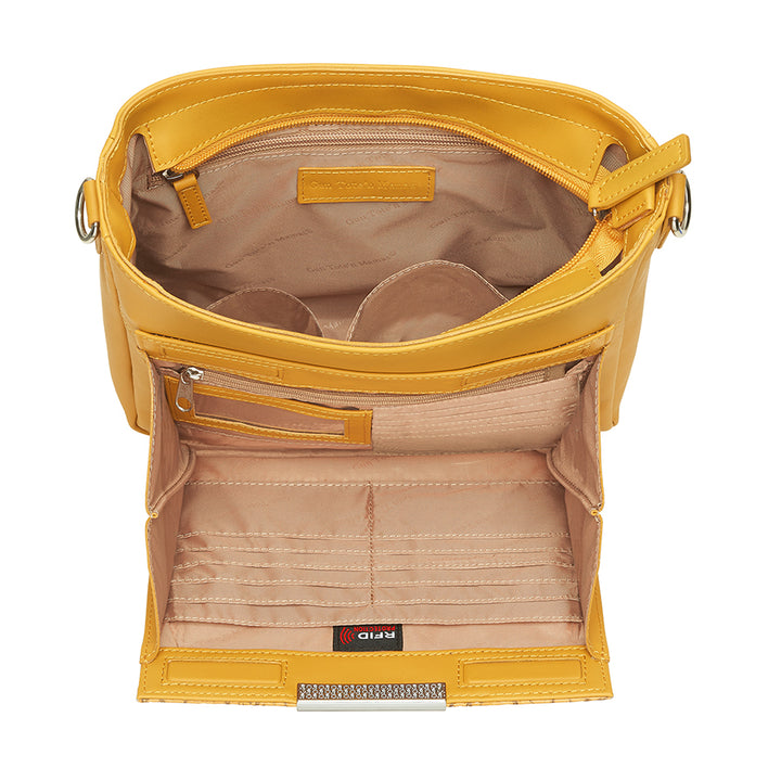 Mustard yellow slim crossbody concealed carry purse crafted from durable American cowhide, featuring compact design and discreet firearm compartment for everyday carry