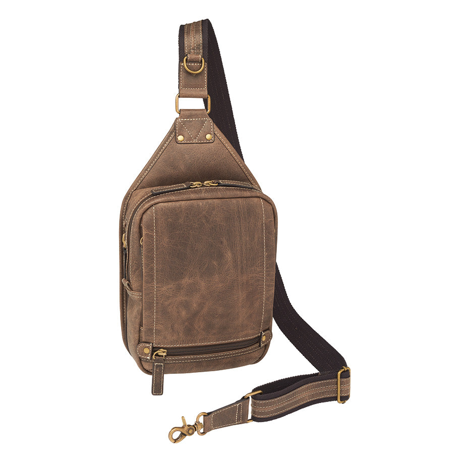 Compact brown mini sling concealed carry backpack made from distressed buffalo leather, designed for discreet, secure, and comfortable everyday firearm carry.
