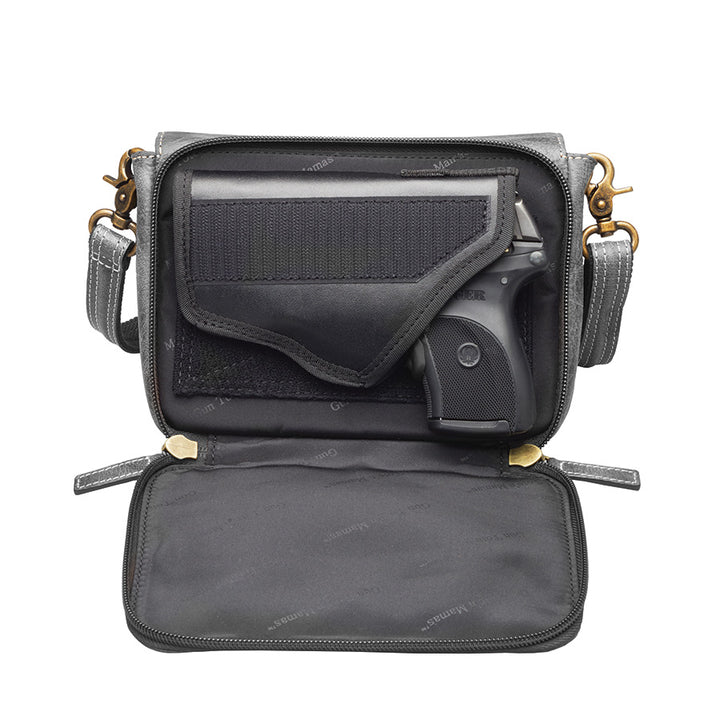 Modern gray crossbody concealed carry organizer purse made of vintage tanned leather, with a discreet firearm compartment, lightweight design, and quick-access zippered opening.