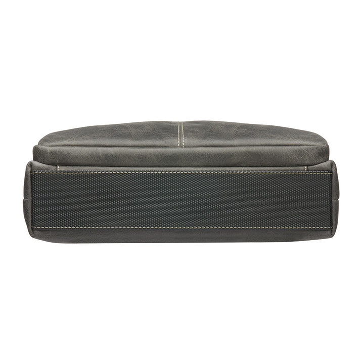 Distressed grey unisex concealed carry crossbody messenger bag in full grain buffalo leather with rich patina, RFID-blocking pocket, magnetic flap closure, and adjustable slash-resistant strap. Features a spacious main compartment and padded gun pocket compatible with Glock 19, Sig P365, S&W M&P 2.0, and more.