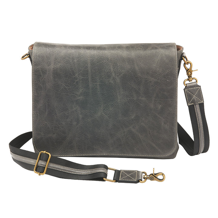 Distressed grey unisex concealed carry crossbody messenger bag in full grain buffalo leather with rich patina, RFID-blocking pocket, magnetic flap closure, and adjustable slash-resistant strap. Features a spacious main compartment and padded gun pocket compatible with Glock 19, Sig P365, S&W M&P 2.0, and more.
