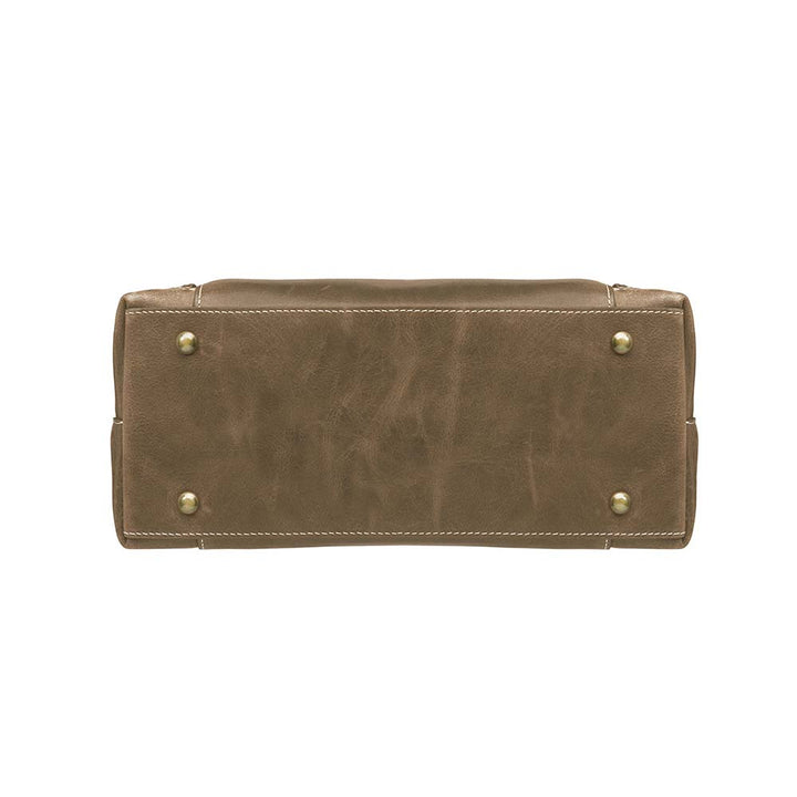 Distressed brown full grain buffalo leather town tote with concealed carry compartment. Vintage-inspired patina develops with use. Features reinforced slash-resistant shoulder strap, padded interior for gun protection, and dual top handles for versatile carry. Designed for ambidextrous draw, includes multiple pockets for phone, pepper spray, and essentials. Tested with popular pistols, equipped with Mernickle holster. Durable and stylish everyday concealed carry purse.
