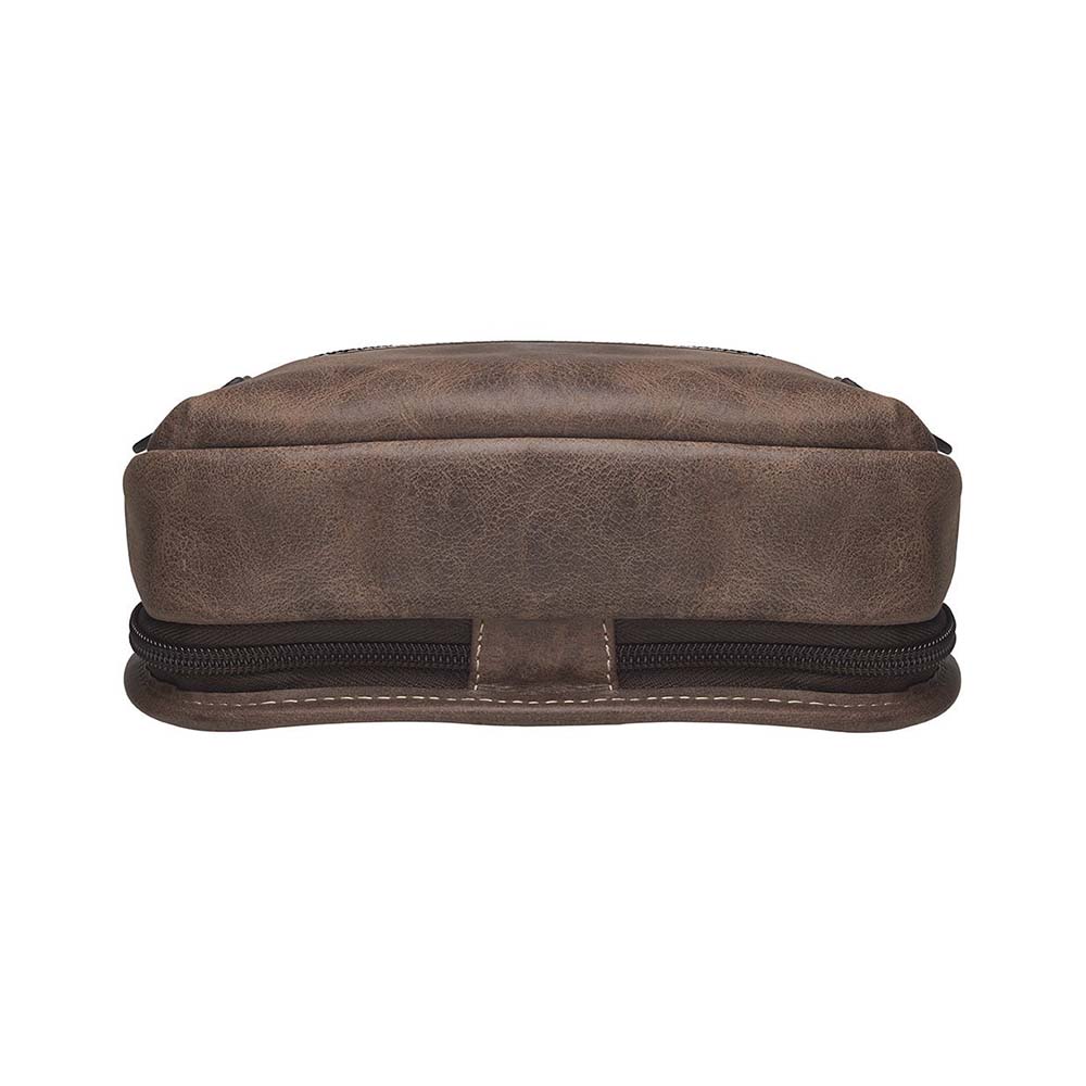 Distressed brown buffalo leather sling concealed carry backpack with tactical organization, RFID zip pocket, padded holster compartment for Glock 19, Sig P320, and HK VP9, slash-proof strap, and swing-front crossbody design with 3 exterior zip pockets and morale patch zone