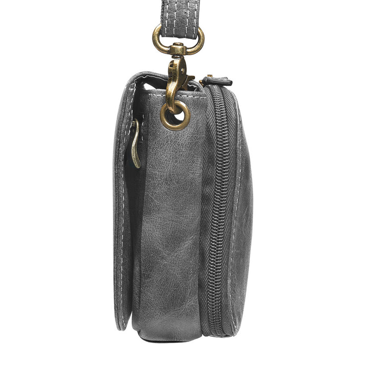 Modern gray crossbody concealed carry organizer purse made of vintage tanned leather, with a discreet firearm compartment, lightweight design, and quick-access zippered opening.