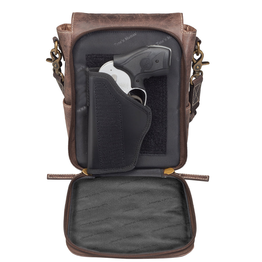 Front view of GTM/CZY-80 Distressed Leather Crossbody Satchel partially open showing concealed handgun being drawn for quick access and secure carry