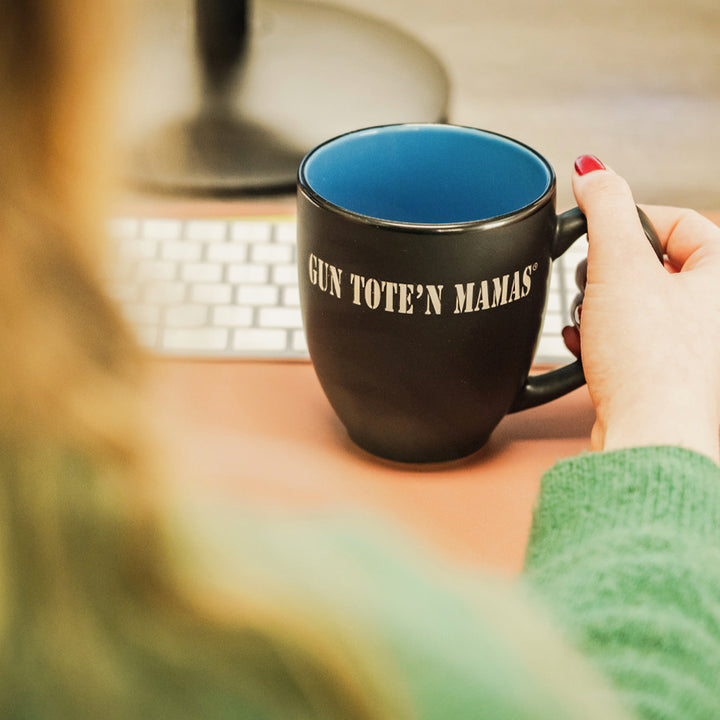 Professional girl in a offie with BISTRO Gun Tote’n Mamas mug with laser-etched logo – two-toned matte black and glossy blue, 16oz ceramic stoneware, dishwasher safe, free shipping