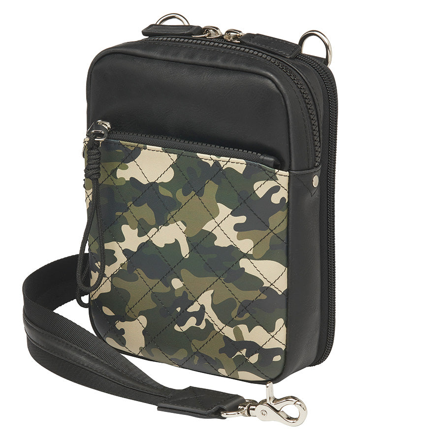 Compact camo-patterned crossbody concealed carry bag with black leather accents, slash-resistant strap, RFID protection, and a secure zippered front pocket for discreet firearm storage