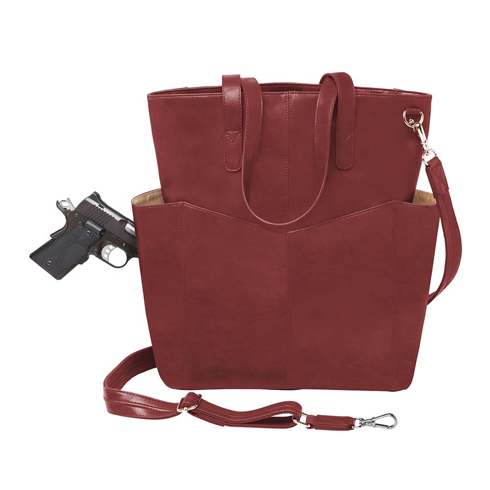 Bold red concealed carry purse – oversized leather tote with crossbody holster for fashion-forward women who carry; perfect for travel, work, or everyday protection.