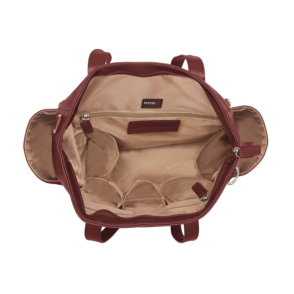 Bold red concealed carry purse – oversized leather tote with crossbody holster for fashion-forward women who carry; perfect for travel, work, or everyday protection.