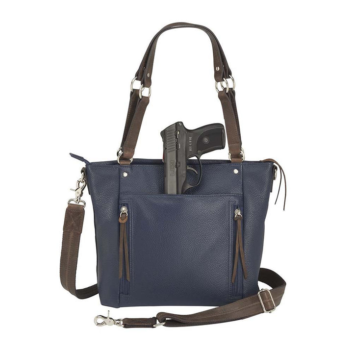 Blue indigo BOHO shoulder tote concealed carry purse combining soft American cowhide and distressed vintage buffalo leather, featuring top draw GTM compartment with rare earth magnets, RFID-protected zippered pocket, adjustable slash-resistant shoulder strap with 11-ply steel cable, antiqued brass hardware, nylon coil zippers, and textured faux bottom with metal feet for stability.