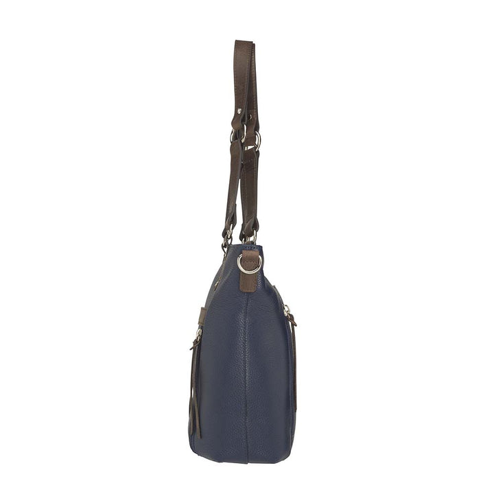 Blue indigo BOHO shoulder tote concealed carry purse combining soft American cowhide and distressed vintage buffalo leather, featuring top draw GTM compartment with rare earth magnets, RFID-protected zippered pocket, adjustable slash-resistant shoulder strap with 11-ply steel cable, antiqued brass hardware, nylon coil zippers, and textured faux bottom with metal feet for stability.