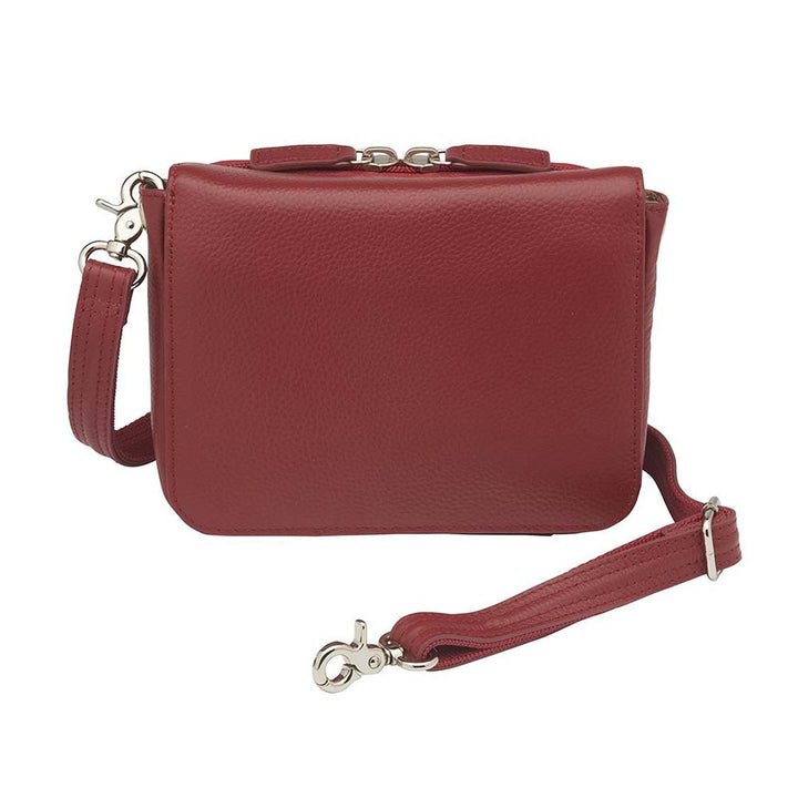 Red compact crossbody organizer concealed carry purse made from soft American cowhide with pebble grain texture, lightweight and durable, featuring RFID-protected zippered pocket, rare earth magnetic flap closure, slash-resistant adjustable shoulder strap with steel wire reinforcement, padded gun compartment, includes mini Mernickle holster, designed for left and right-handed use.
