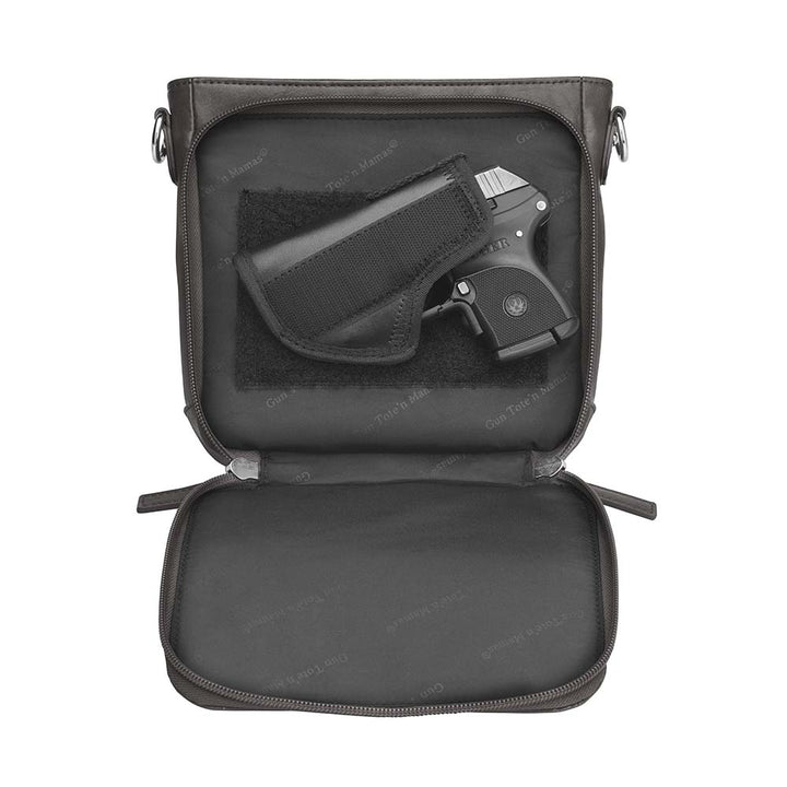 Black mini crossbody concealed carry purse for women with RFID-protected built-in wallet organizer, slash-resistant adjustable strap, zippered gun compartment for Ruger LCP, Kahr 9, and Kahr 380, washable American cowhide leather, GTM logo lining, magnetic closure, and minimalist everyday carry design.