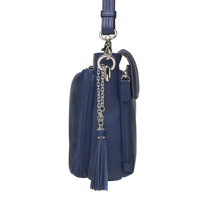 Indigo blue clutch-style concealed carry purse in soft American cowhide with RFID-protected front organizer, adjustable crossbody slash-resistant strap, triple-zip gun access for Glock 27, Ruger LCP, S&W Shield, and more. Lightweight, padded, stylish, and discreet everyday carry solution for women.