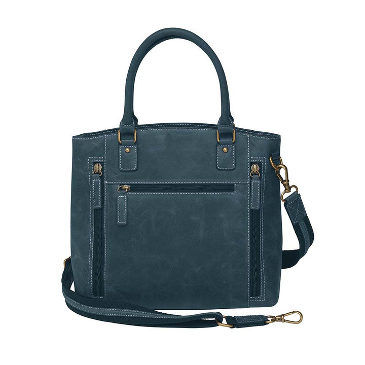 Rich distressed blue leather town tote purse with concealed carry pocket. Made from vintage full grain buffalo leather with soft, worn-in feel that deepens over time. Slash-resistant adjustable crossbody strap with padded gun compartment to prevent imprinting. Includes front and rear zippered pockets, designed for left or right hand draw. Comes with trusted Mernickle holster, perfect for discreet everyday carry with style and durability.