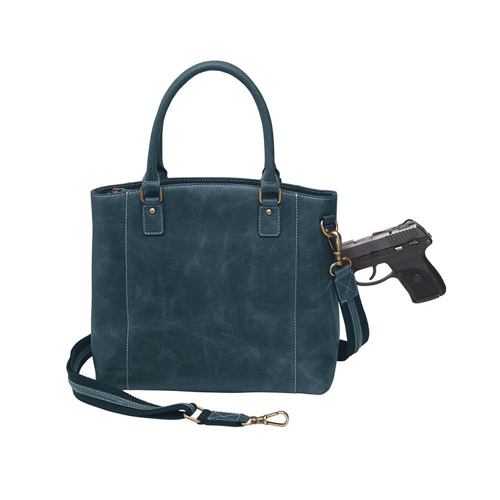 Rich distressed blue leather town tote purse with concealed carry pocket. Made from vintage full grain buffalo leather with soft, worn-in feel that deepens over time. Slash-resistant adjustable crossbody strap with padded gun compartment to prevent imprinting. Includes front and rear zippered pockets, designed for left or right hand draw. Comes with trusted Mernickle holster, perfect for discreet everyday carry with style and durability.