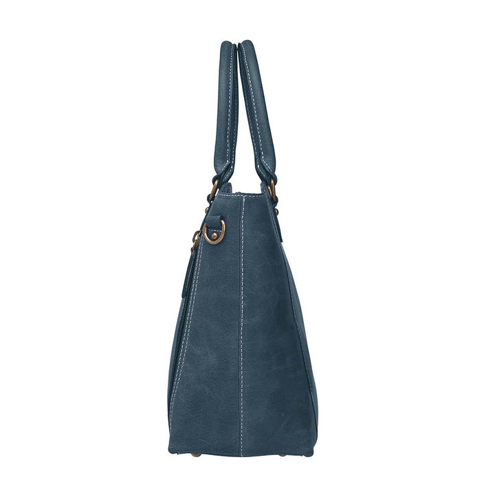 Rich distressed blue leather town tote purse with concealed carry pocket. Made from vintage full grain buffalo leather with soft, worn-in feel that deepens over time. Slash-resistant adjustable crossbody strap with padded gun compartment to prevent imprinting. Includes front and rear zippered pockets, designed for left or right hand draw. Comes with trusted Mernickle holster, perfect for discreet everyday carry with style and durability.