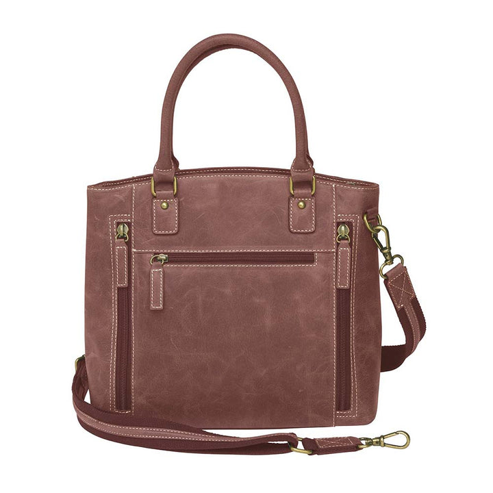 Bold distressed red full grain buffalo leather town tote with concealed carry functionality. Soft yet rugged vintage leather develops unique patina with everyday wear. Slash-resistant adjustable crossbody strap with padded gun compartment protects against imprinting. Designed for ambidextrous draw, multiple organizational pockets including secure zipper compartments. Includes Mernickle holster tested for compact and subcompact pistols. Perfect for confident, stylish concealed carry.