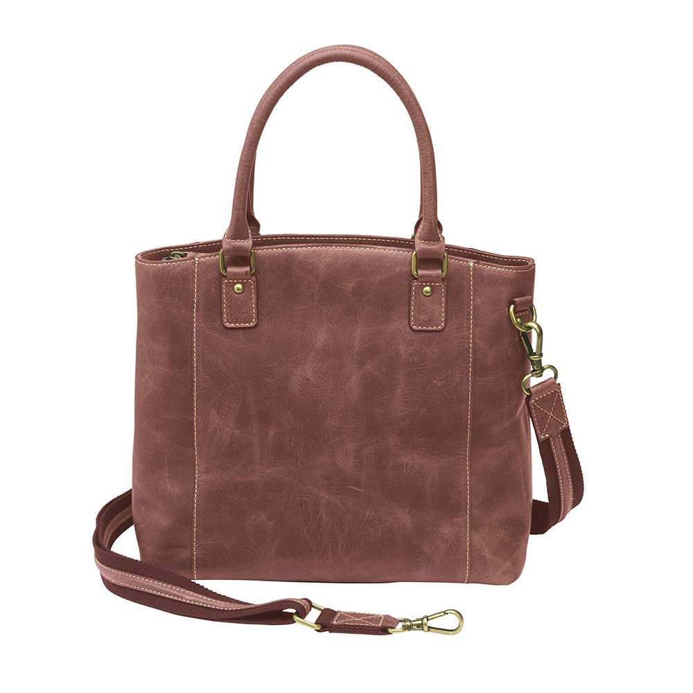 Bold distressed red full grain buffalo leather town tote with concealed carry functionality. Soft yet rugged vintage leather develops unique patina with everyday wear. Slash-resistant adjustable crossbody strap with padded gun compartment protects against imprinting. Designed for ambidextrous draw, multiple organizational pockets including secure zipper compartments. Includes Mernickle holster tested for compact and subcompact pistols. Perfect for confident, stylish concealed carry.