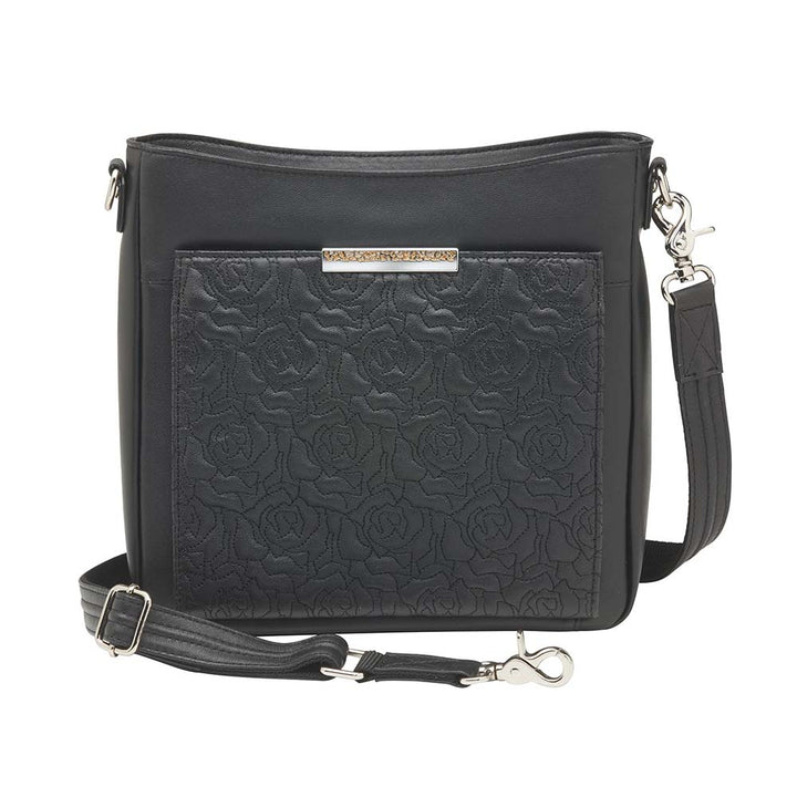 Luxury black lambskin concealed carry crossbody purse made from New Zealand full-grain leather; features RFID-protected wallet organizer, top-draw ambidextrous access, slash-resistant strap, padded CCW holster fits Glock 19, Sig P320, M&P Shield; sleek day-to-night design with magnetic closures and chrome accents.