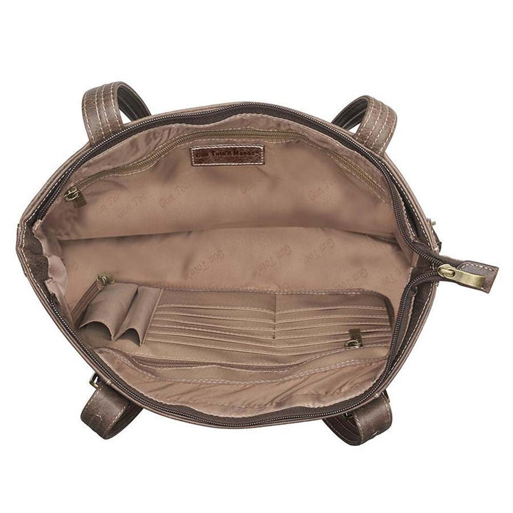 Distressed vintage buffalo leather shoulder portfolio concealed carry purse with slash-resistant double shoulder straps, patent-pending CCW rear zippered compartment for left or right-hand draw, padded to prevent imprinting, includes Mernickle holster, fits iPads and small laptops, RFID-protected organizer, top zipper closure, and chrome feet for stability—ideal for office or everyday carry.