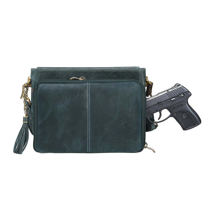 Step up your carry game with this vintage-inspired clutch in rich distressed blue full-grain buffalo leather. The more you rock it, the softer and more unique it becomes thanks to the natural aging process and oils infused during tanning. Designed for both left and right-hand carry, it features special padding to prevent imprinting, plus a slash-resistant shoulder strap reinforced with 11-ply steel wire for maximum security.
