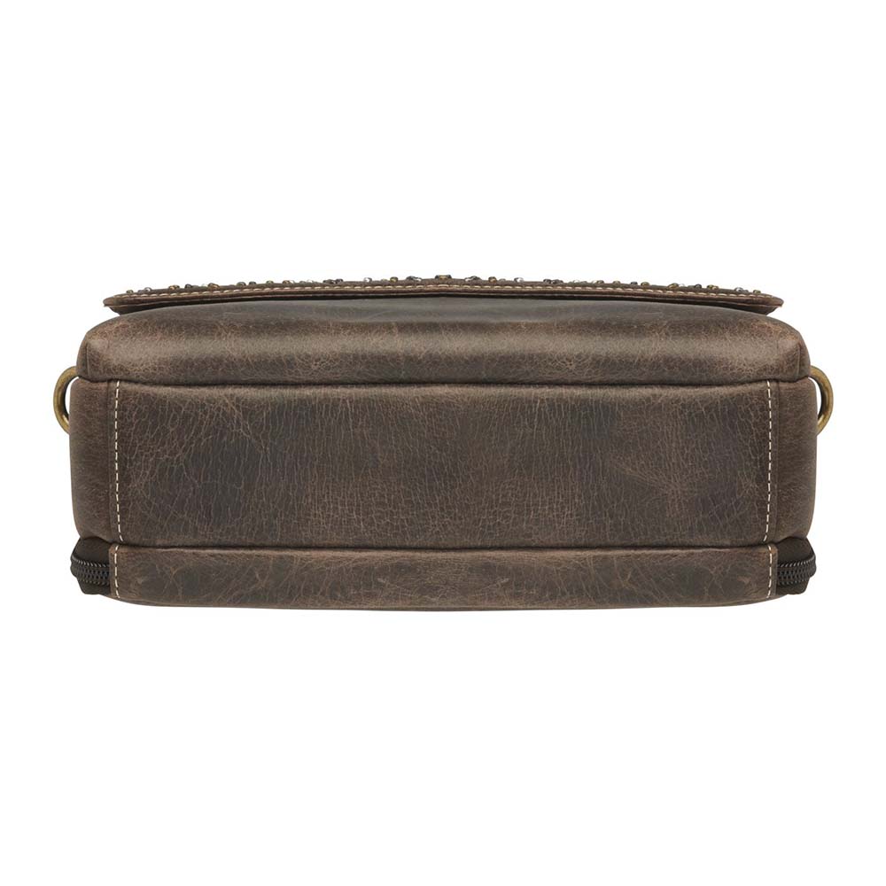 Timeless and tough — this brown distressed full-grain buffalo leather clutch gets better with age and wear. Designed to fit both left and right-handed carriers, it offers special padding to prevent imprinting and a slash-resistant shoulder strap reinforced with 11-ply steel wire for solid security.
