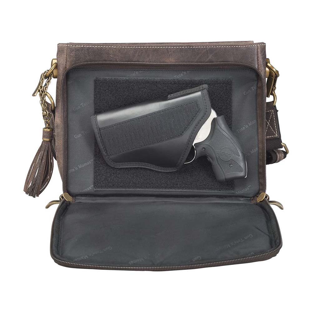Timeless and tough — this brown distressed full-grain buffalo leather clutch gets better with age and wear. Designed to fit both left and right-handed carriers, it offers special padding to prevent imprinting and a slash-resistant shoulder strap reinforced with 11-ply steel wire for solid security.
