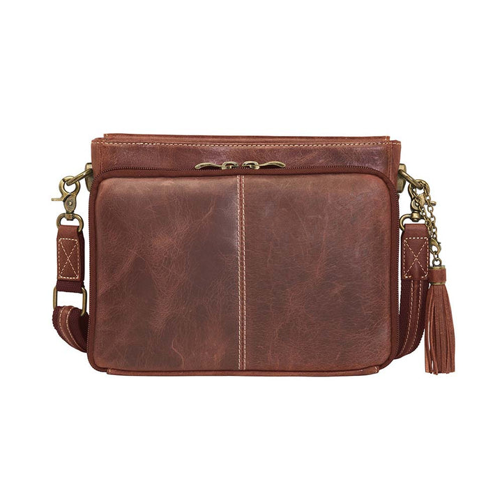 Timeless and tough — this brown distressed full-grain buffalo leather clutch gets better with age and wear. Designed to fit both left and right-handed carriers, it offers special padding to prevent imprinting and a slash-resistant shoulder strap reinforced with 11-ply steel wire for solid security.