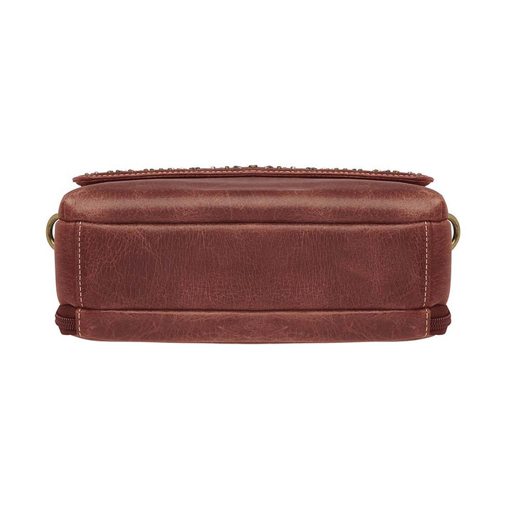 Timeless and tough — this brown distressed full-grain buffalo leather clutch gets better with age and wear. Designed to fit both left and right-handed carriers, it offers special padding to prevent imprinting and a slash-resistant shoulder strap reinforced with 11-ply steel wire for solid security.