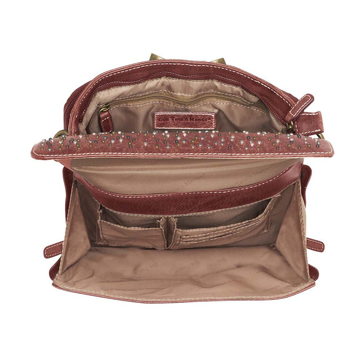 Timeless and tough — this brown distressed full-grain buffalo leather clutch gets better with age and wear. Designed to fit both left and right-handed carriers, it offers special padding to prevent imprinting and a slash-resistant shoulder strap reinforced with 11-ply steel wire for solid security.