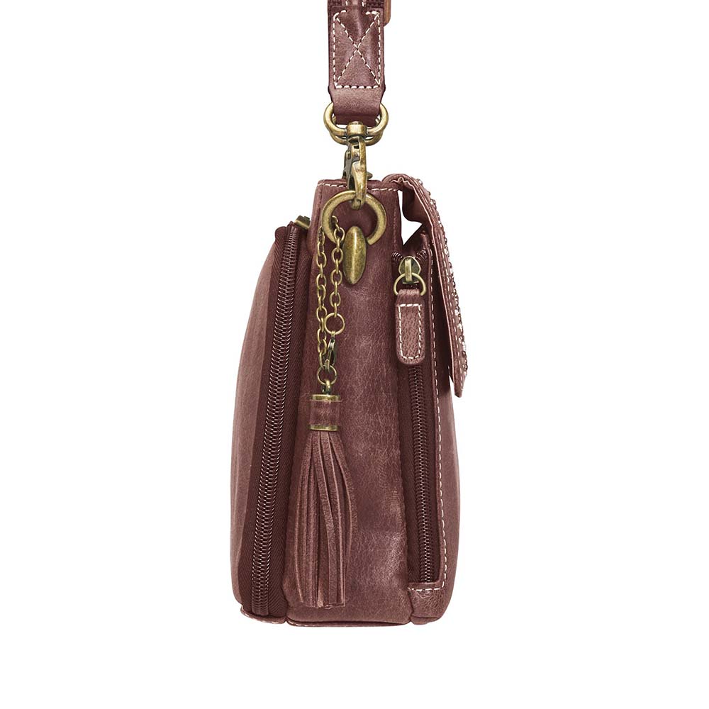 Timeless and tough — this brown distressed full-grain buffalo leather clutch gets better with age and wear. Designed to fit both left and right-handed carriers, it offers special padding to prevent imprinting and a slash-resistant shoulder strap reinforced with 11-ply steel wire for solid security.