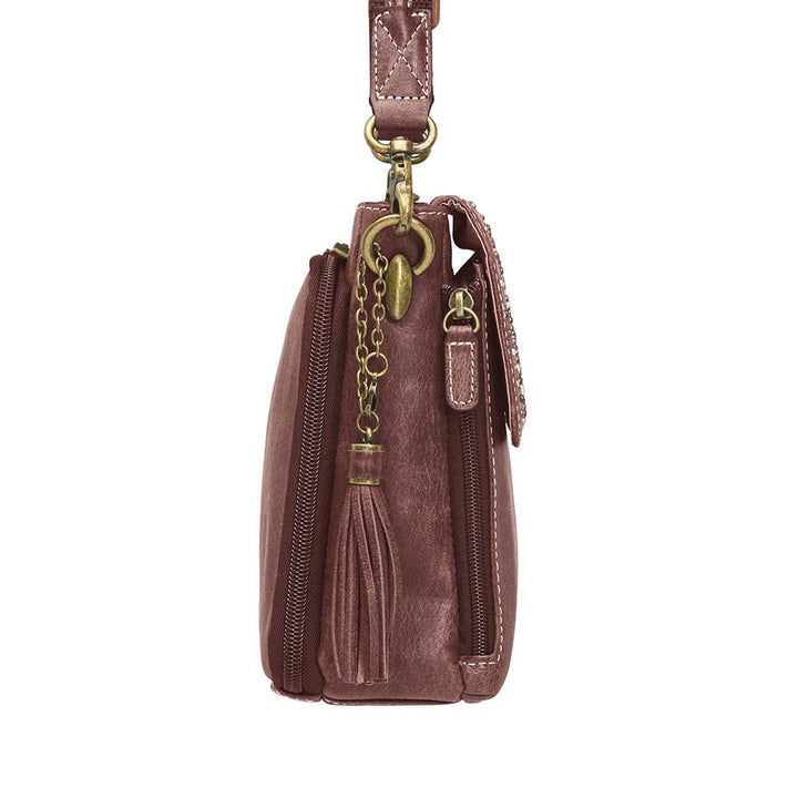 Timeless and tough — this brown distressed full-grain buffalo leather clutch gets better with age and wear. Designed to fit both left and right-handed carriers, it offers special padding to prevent imprinting and a slash-resistant shoulder strap reinforced with 11-ply steel wire for solid security.