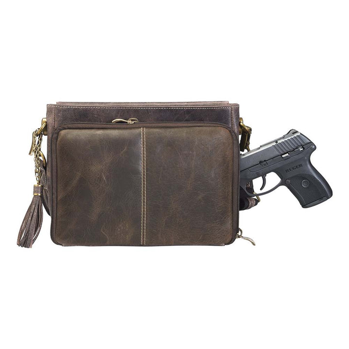 Timeless and tough — this brown distressed full-grain buffalo leather clutch gets better with age and wear. Designed to fit both left and right-handed carriers, it offers special padding to prevent imprinting and a slash-resistant shoulder strap reinforced with 11-ply steel wire for solid security.