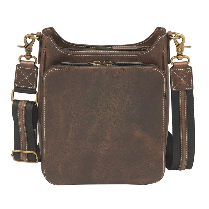Distressed brown buffalo leather crossbody mail pouch with vintage patina, RFID protection, slash-resistant strap, and concealed carry holster compatible with left or right draw