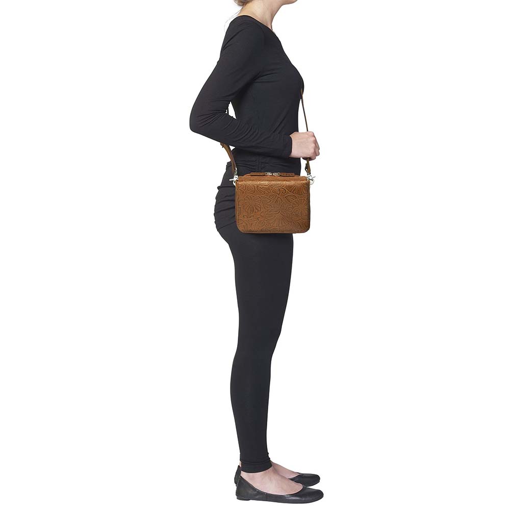 women modeling a leather purse