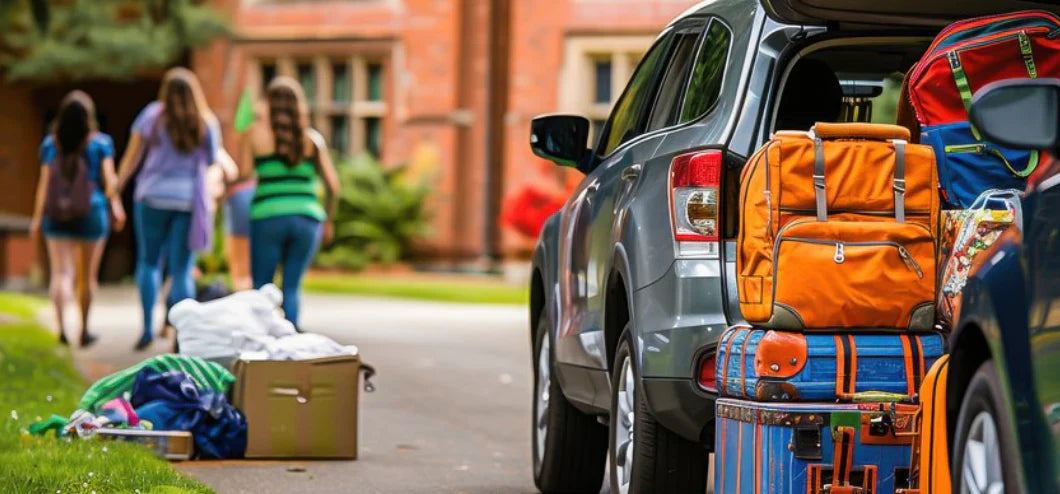  girls moving into a dorm with a car loaded