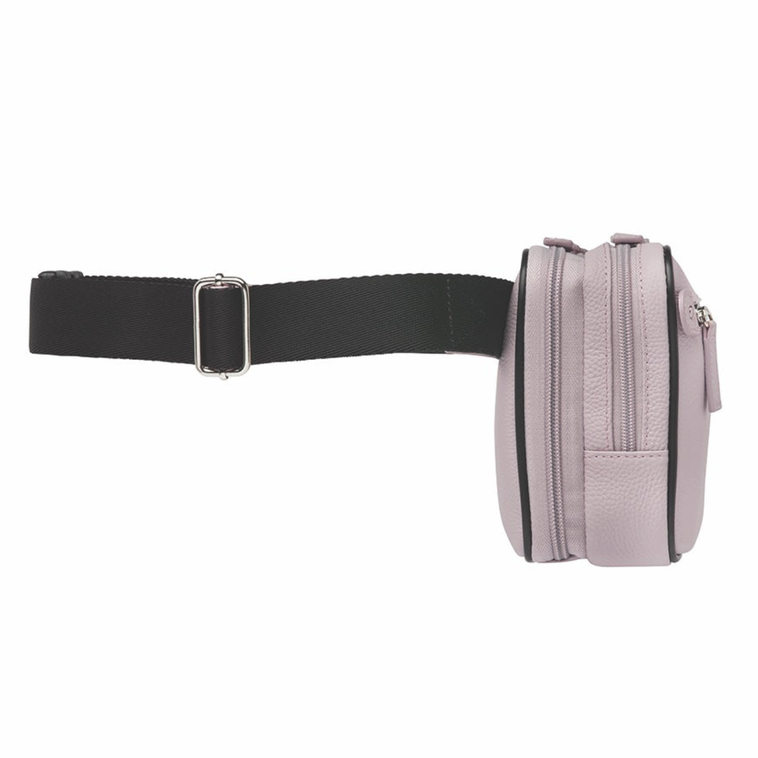 Lavender concealed carry sling waist pack made from soft pebbled American cowhide, with RFID zip pocket, crossbody or waist wear options, and discreet 3-sided access gun compartment with MINI holster compatibility.