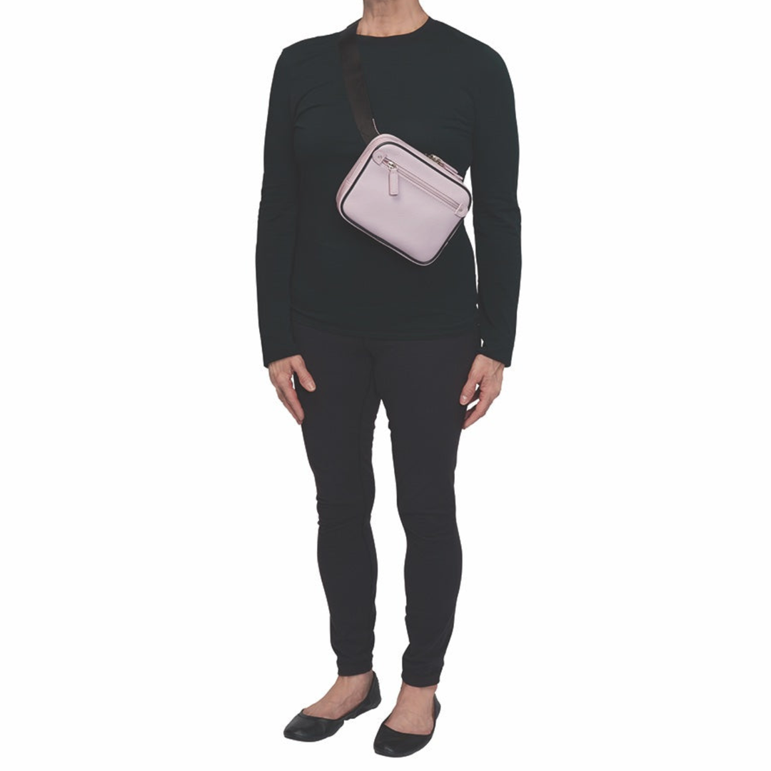 Lavender concealed carry sling waist pack made from soft pebbled American cowhide, with RFID zip pocket, crossbody or waist wear options, and discreet 3-sided access gun compartment with MINI holster compatibility.