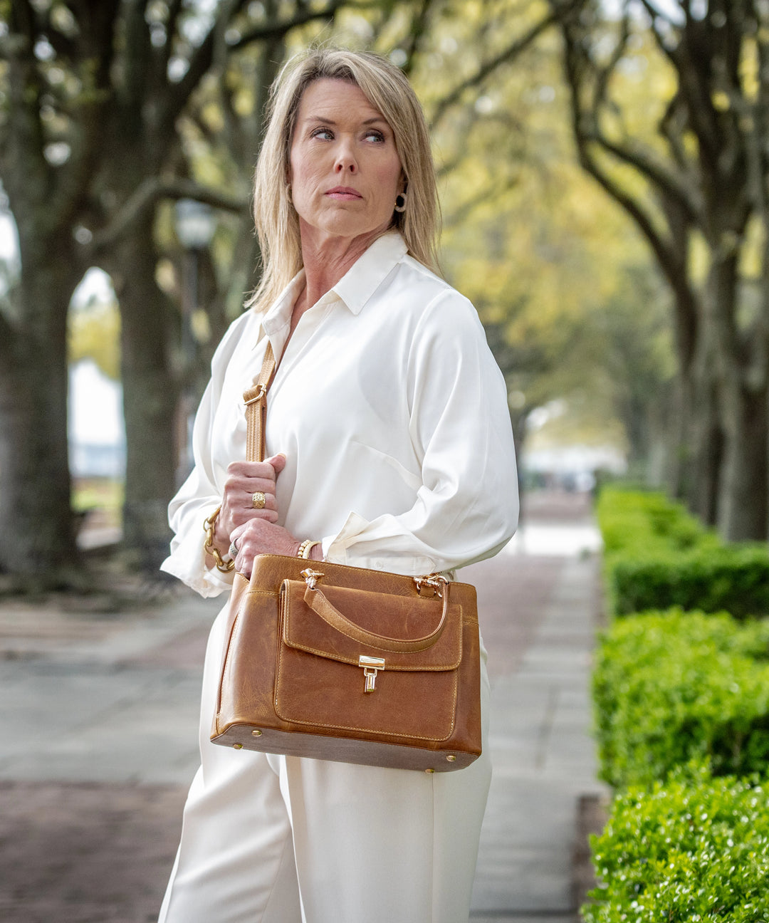 GTMoriginals Avenue Large Satchel Concealed Carry Sling Bag GTM-32/CRML with urban design and adjustable strap, shown on a model.