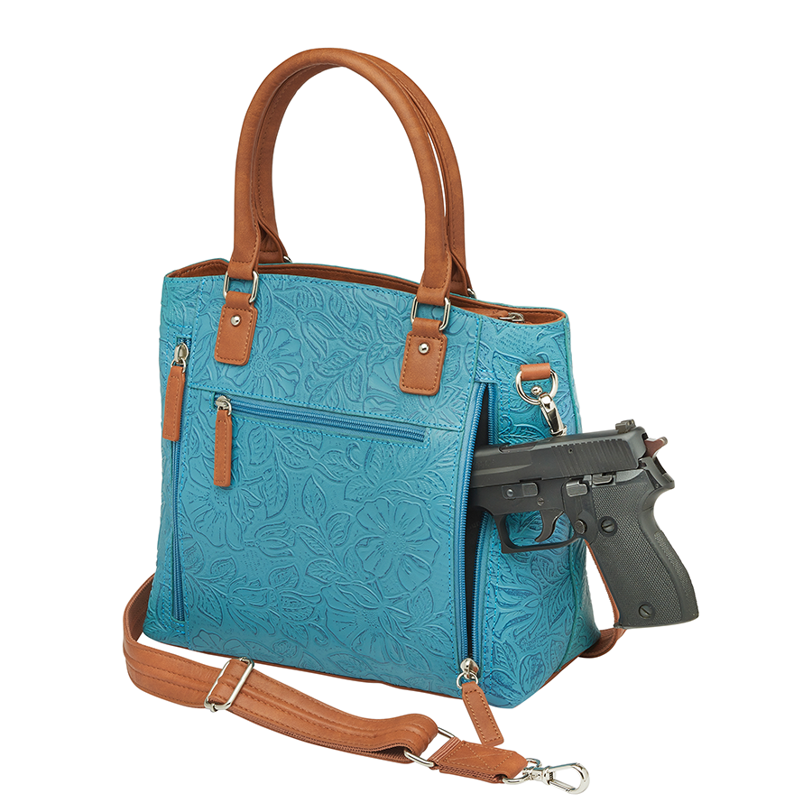 Teal and brown Town Tote concealed carry bag in tooled cowhide leather – spacious CCW compartment, durable design with adjustable shoulder strap, fits compact firearms, GTM-51